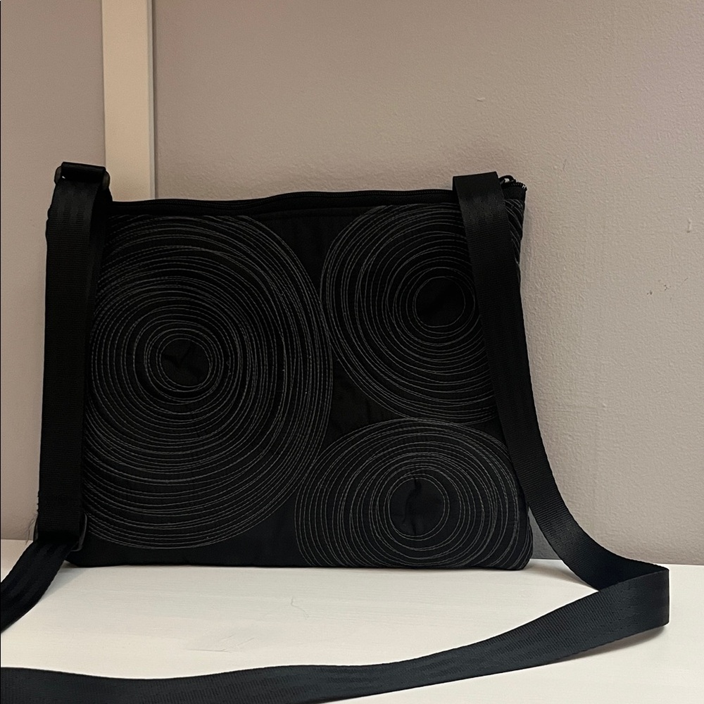 Tenacious Flat Black Crossbody Bag